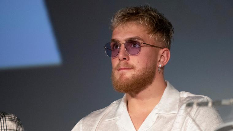 Jake Paul's guarantee for Tommy Fury fight includes a vodka bottle tattoo & gold briefcase with $250,000 image