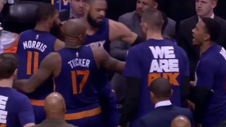 Markieff Morris tries to fight Archie Goodwin during team huddle image