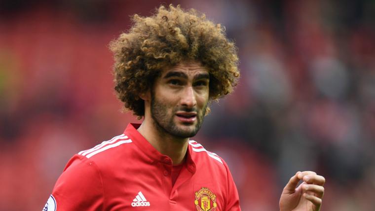 'He spat at a girl!' - Fellaini bites back at Carragher image