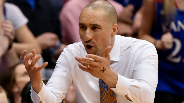 Shaka Smart bewilders Texas fans by growing out hair after years of baldness image