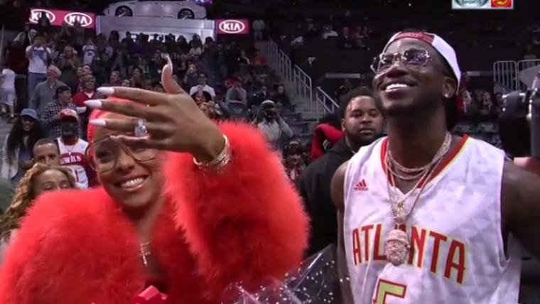 Gucci Mane gets engaged during Hawks game image