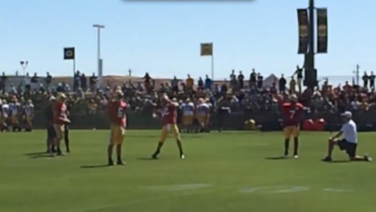 Aaron Rodgers launches football into net from midfield image