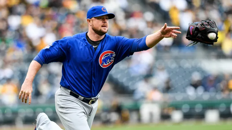WATCH: Cubs lefty Jon Lester tosses his glove to first base for the out image