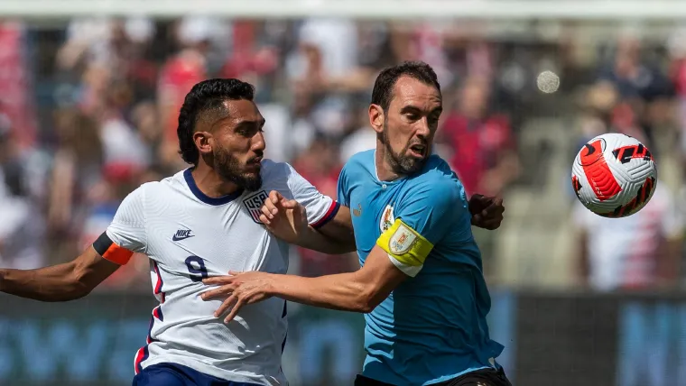 Jesus Ferreira of USA and Diego Godin of Uruguay