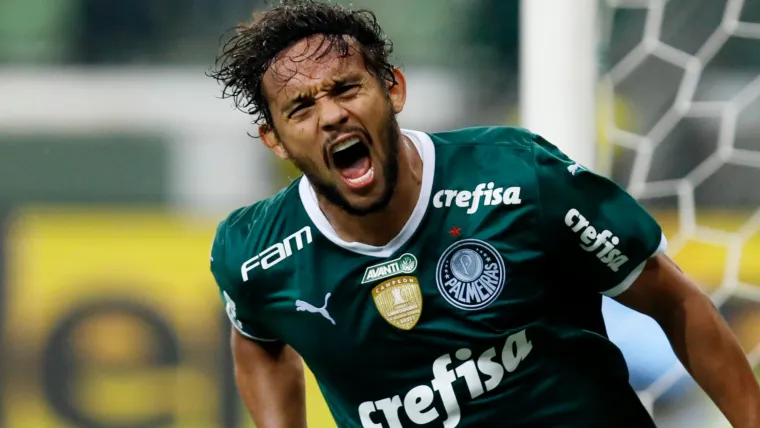 Gustavo Scarpa of Palmeiras celebrates a goal against Atletico Goianiense in the 2022 Brasilerao