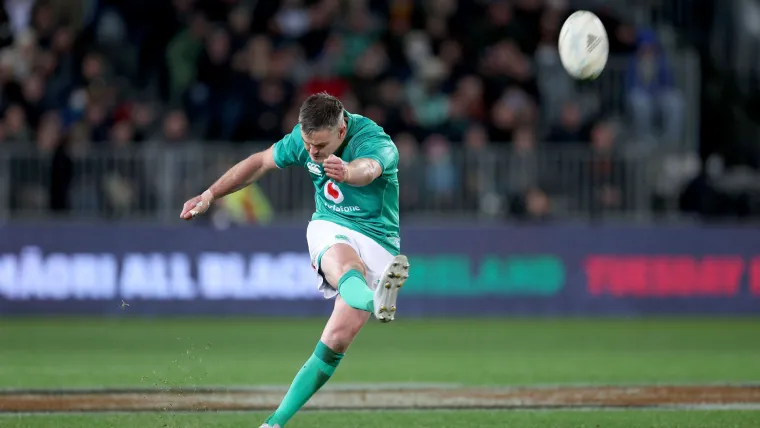 A photo of Johnny Sexton scoring for Ireland