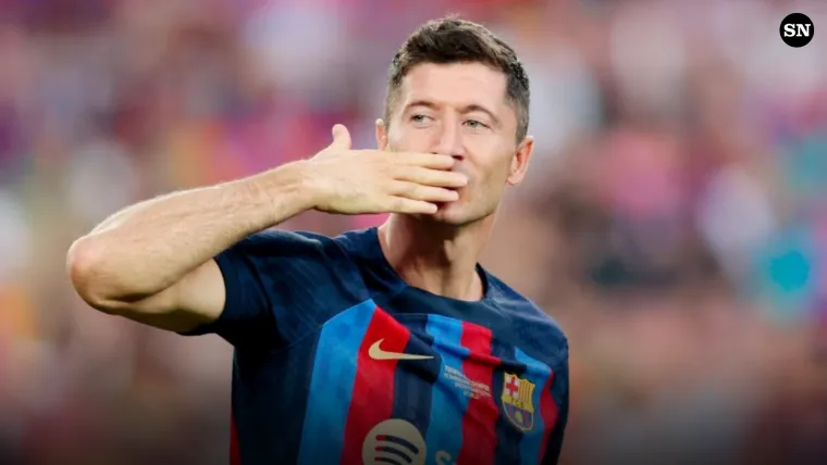 Robert Lewandowski blows a kiss to the Camp Nou crowd after scoring for Barcelona