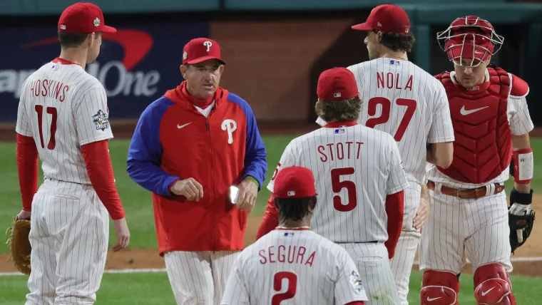 Rob Thomson (left) and Aaron Nola (27)