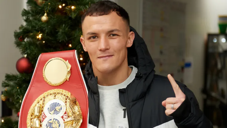 Josh Warrington holding a belt