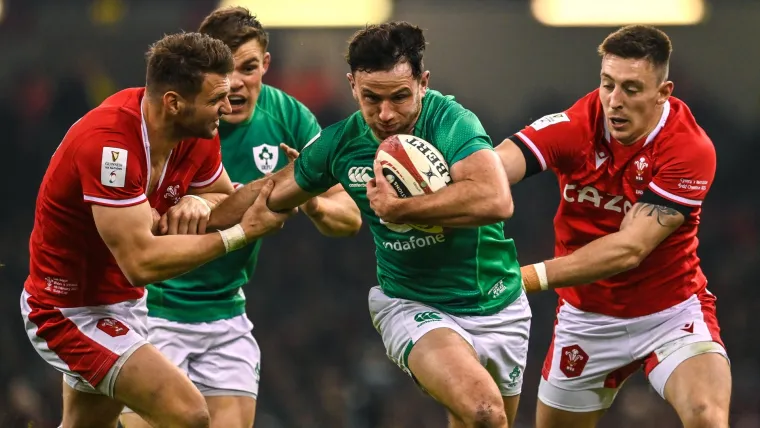 Hugo Keenan runs with the ball in Ireland's Six Nations match with Wales