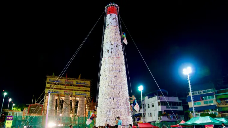 Bun snatching competition at the Cheung Chau Bun Festival. Photo: Shutterstock