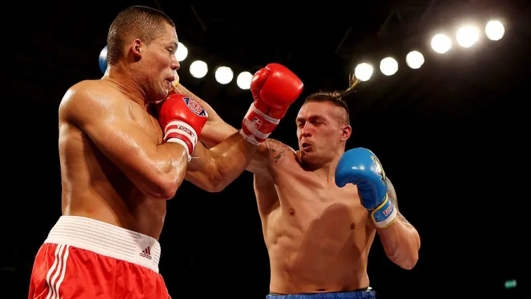 Oleksandr Usyk (right) goes after Joe Joyce - World Series of Boxing