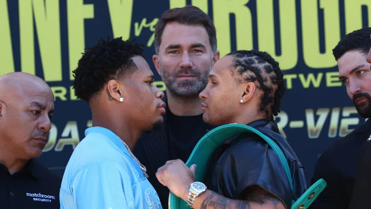 Devin Haney and Regis Prograis stae each other down