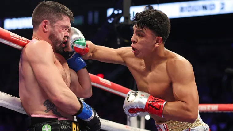 Jaime Munguia smashes a right into the face of John Ryder