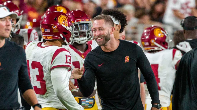 Caleb Williams (13) and Kliff Kingsbury (right)