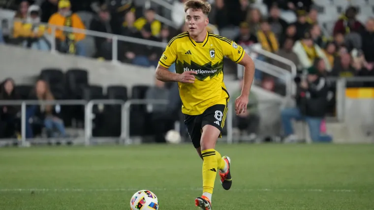 Columbus Crew midfielder Aiden Morris dribbles with the ball. 