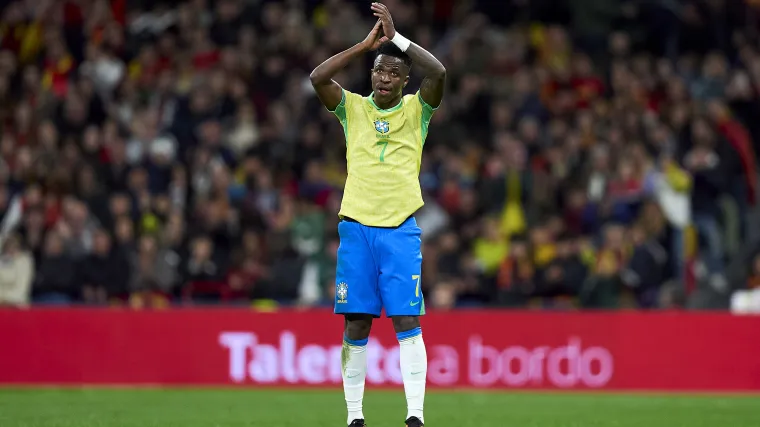 Brazil winger Vinicius Jr. applauds fans during a game