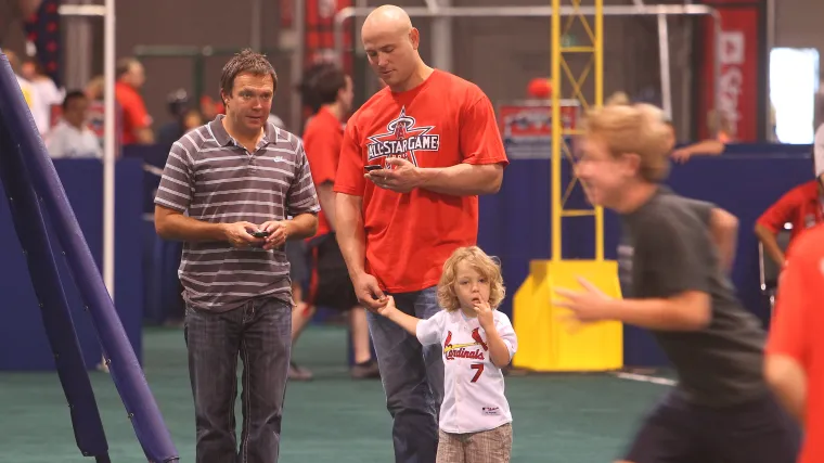 Matt Holliday (center) and Jackson Holliday (7)