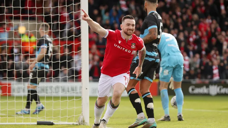 Jack Marriott celebrates scoring a goal for Wrexham