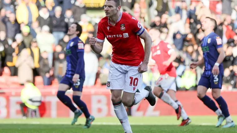 Paul Mullin celebrates scoring a goal for Wrexham