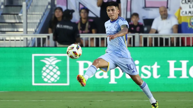 Atlanta United playmaker Thiago Almada controls a pass during a game. 