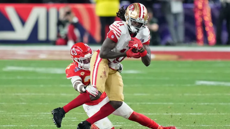 Feb 11, 2024; Paradise, Nevada, USA; Kansas City Chiefs safety Mike Edwards (21) tackles San Francisco 49ers wide receiver Brandon Aiyuk (11) during overtime of Super Bowl LVIII at Allegiant Stadium. Mandatory Credit: Kyle Terada-USA TODAY Sports