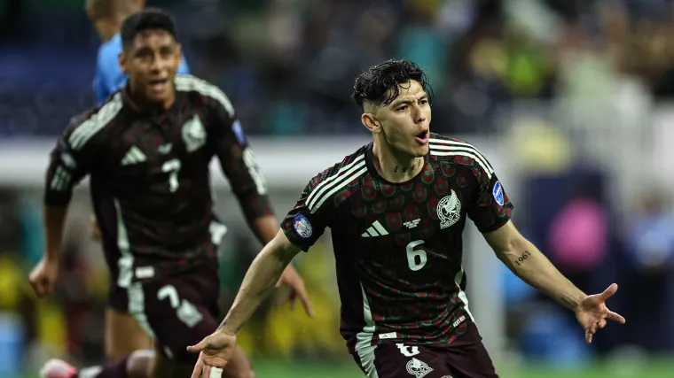 Mexico left back Gerardo Arteaga celebrates scoring a goal. 