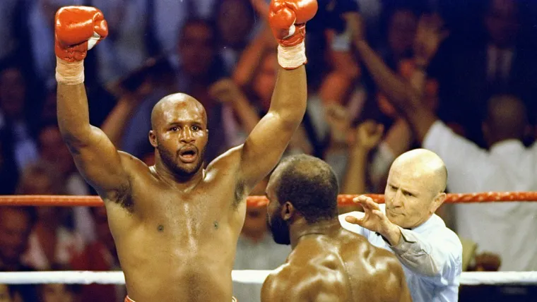 Michael Moorer outpoints Evander Holyfield