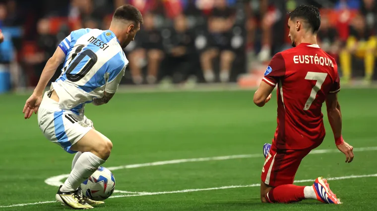 Lionel Messi of Argentina and Stephen Eustaquio of Canada