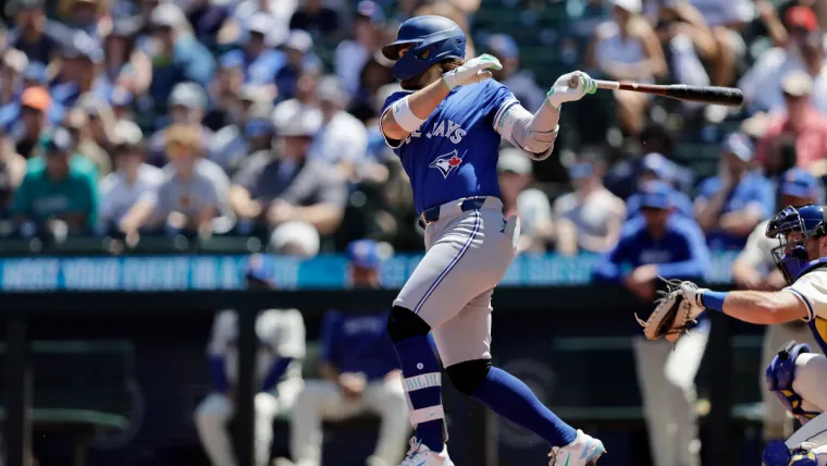 Jul 7, 2024; Seattle, Washington, USA; Toronto Blue Jays shortstop Bo Bichette (11) hits a ground rule double against the Seattle Mariners during the fourth inning against the Seattle Mariners at T-Mobile Park. Mandatory Credit: John Froschauer-USA TODAY Sports