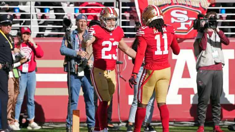 Nov 19, 2023; Santa Clara, California, USA; San Francisco 49ers running back Christian McCaffrey (23) celebrates with wide receiver Brandon Aiyuk (11) after scoring a touchdown against the Tampa Bay Buccaneers during the first quarter at Levi's Stadium. Mandatory Credit: Darren Yamashita-USA TODAY Sports