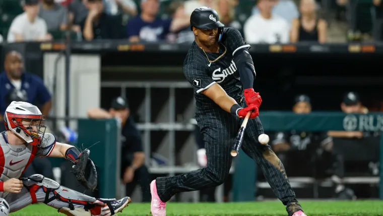 Jul 8, 2024; Chicago, Illinois, USA; Chicago White Sox designated hitter Eloy Jimenez (74) hits an RBI-single against the Minnesota Twins during the sixth inning at Guaranteed Rate Field. Mandatory Credit: Kamil Krzaczynski-USA TODAY Sports