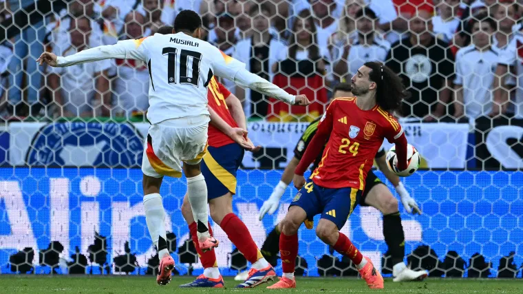 Jamal Musiala of Germany and Marc Cucurella of Spain at Euro 2024