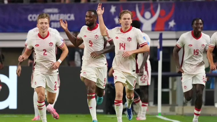 Jacob Shaffelburg celebrates scoring a goal for Canada