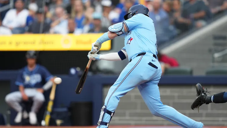 Jul 23, 2024; Toronto, Ontario, CAN; Toronto Blue Jays designated hitter Justin Turner (2) hits a single against the Tampa Bay Rays during the first inning at Rogers Centre. Mandatory Credit: Nick Turchiaro-USA TODAY Sports