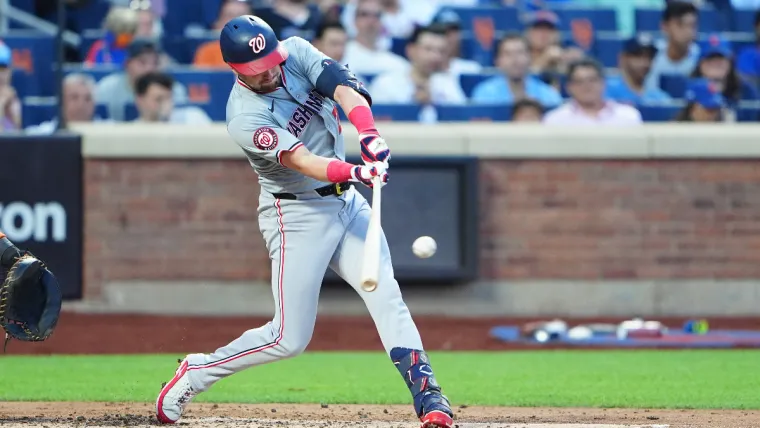 Jul 10, 2024; New York City, New York, USA; Washington Nationals right fielder Lane Thomas (28) hits a single against the New York Mets during the fourth inning at Citi Field. Mandatory Credit: Gregory Fisher-USA TODAY Sports