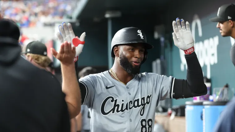 Jul 24, 2024; Arlington, Texas, USA; Chicago White Sox center fielder Luis Robert Jr. (88) celebrates with teammates in the dugout after hitting a home run during the third inning against the Texas Rangers at Globe Life Field. Mandatory Credit: Kevin Jairaj-USA TODAY Sports