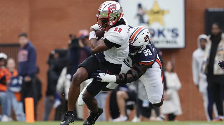 Malachi Corley runs after catch