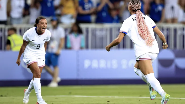 USWNT forwards Mallory Swanson and Trinity Rodman celebrate scoring a goal