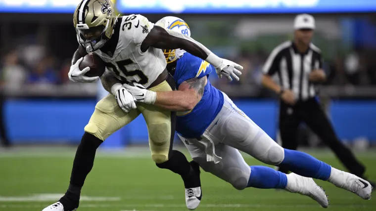 New Orleans Saints running back Ellis Merriweather (35) is tackled by Los Angeles Chargers defensive tackle Scott Matlock (99) 