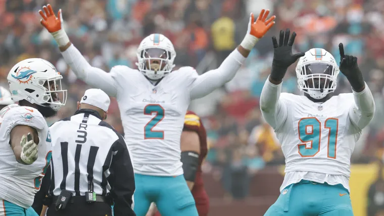 Miami Dolphins edge rushers Emmanuel Ogbah (91) and Bradley Chubb (2) celebrate after a play.