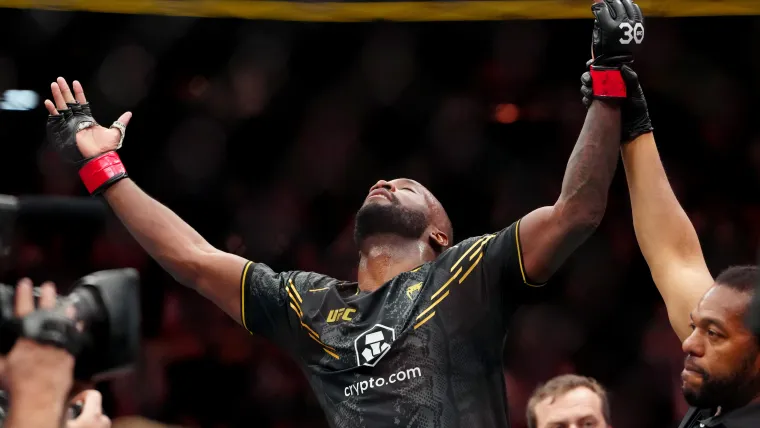 Dec 16, 2023; Las Vegas, Nevada, USA; Leon Edwards (red gloves) reacts after defeating Colby Covington (blue gloves) to retain the UFC welterweight title during UFC 296 at T-Mobile Arena. Mandatory Credit: Stephen R. Sylvanie-USA TODAY Sports