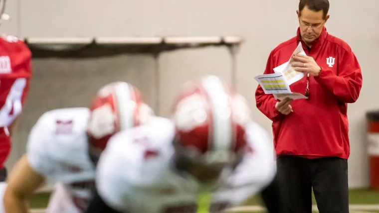 Indiana Head Coach Curt Cignetti looks over charts during warm-up drills during spring practice at the Mellencamp Pavilion on Tuesday, April 2, 2024.