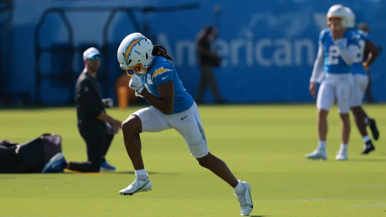 Quentin Johnston (1) runs with a ball during the first day of training camp