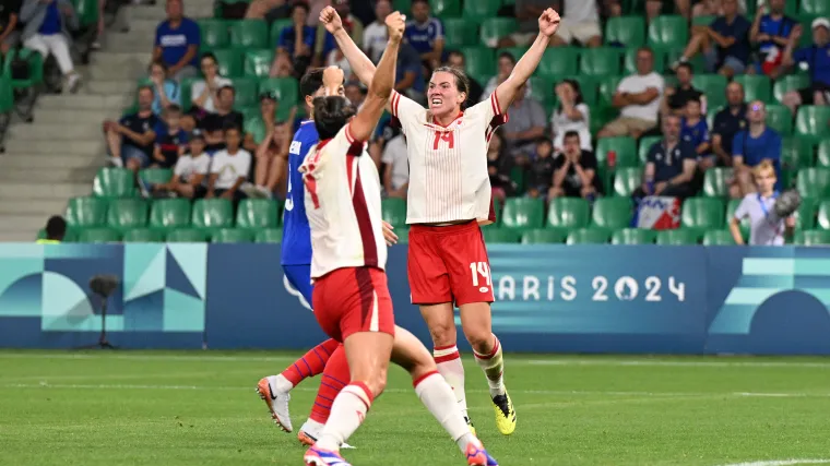 Canada centerback Vanessa Gilles celebrates scoring a goal against France