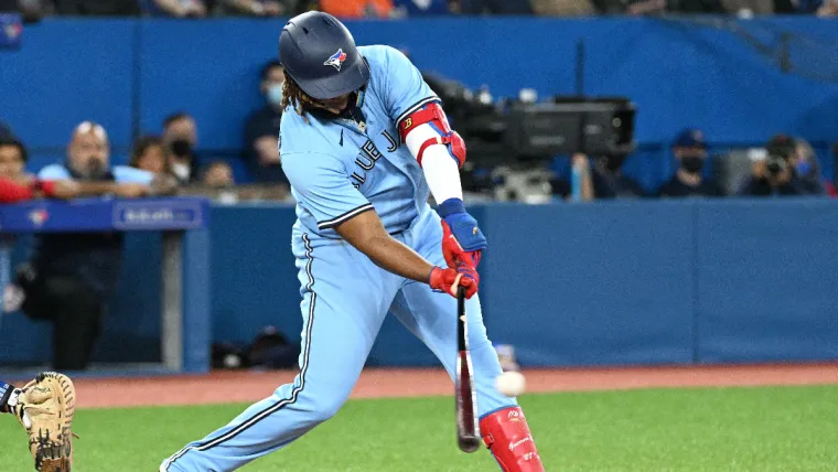 May 4, 2022; Toronto, Ontario, CAN; Toronto Blue Jays first baseman Vladimir Guererro Jr. (27) hits an RBI single against the New York Yankees in the third inning at Rogers Centre. Mandatory Credit: Dan Hamilton-USA TODAY Sports