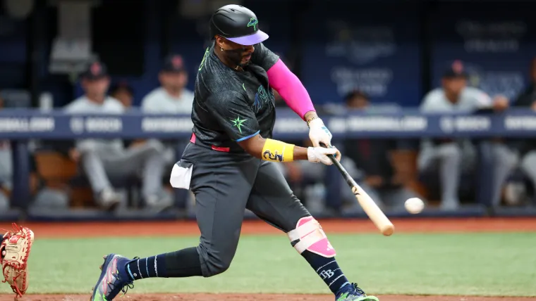 Jul 13, 2024; St. Petersburg, Florida, USA; Tampa Bay Rays first baseman Yandy Diaz (2) hits an rbi double against the Cleveland Guardians in the third inning at Tropicana Field. Mandatory Credit: Nathan Ray Seebeck-USA TODAY Sports