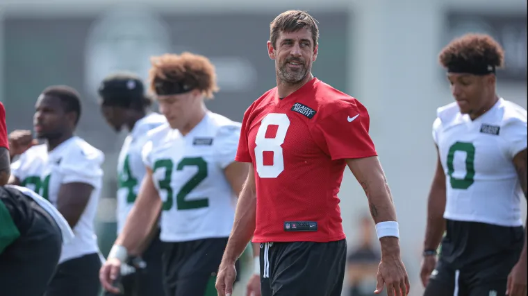 Aaron Rodgers smiles at practice