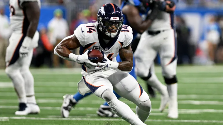 Dec 16, 2023; Detroit, Michigan, USA; Denver Broncos wide receiver Courtland Sutton (14) runs with the ball against the Detroit Lions in the third quarter at Ford Field. Mandatory Credit: Lon Horwedel-USA TODAY Sports