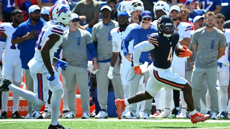 Aug 10, 2024; Orchard Park, New York, USA; Chicago Bears running back D'Andre Swift (4) runs from Buffalo Bills cornerback Rasul Douglas (31) in the first quarter of a pre-season game at Highmark Stadium. Mandatory Credit: Mark Konezny-USA TODAY Sports